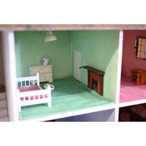 149 - A large Tri-Ang country house doll's house, front opening with fitted interior, c/w various furnitur... 