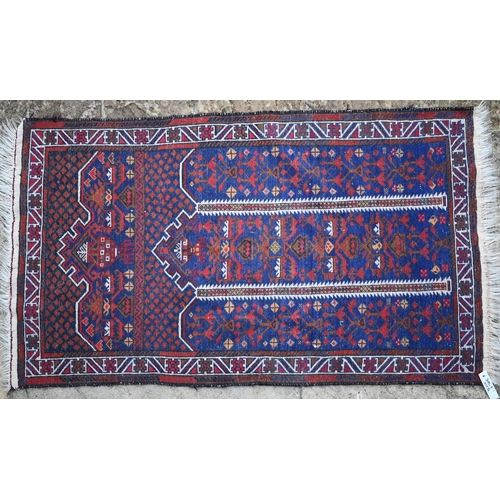 153 - A Persian Baluchi prayer rug, dark blue ground, 140 x 80 cm