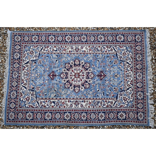 154 - Indo-Persian floral rug, mid-blue ground, rosette border, 180 x 130 cm