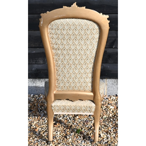 173 - A Continental gilt framed nursing chair with repeating leaf pattern brocade upholstery