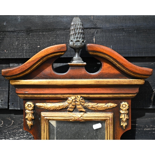 180 - A narrow gilt and walnut framed mirror with three bevelled plates and three demi-lune bracket shelve... 