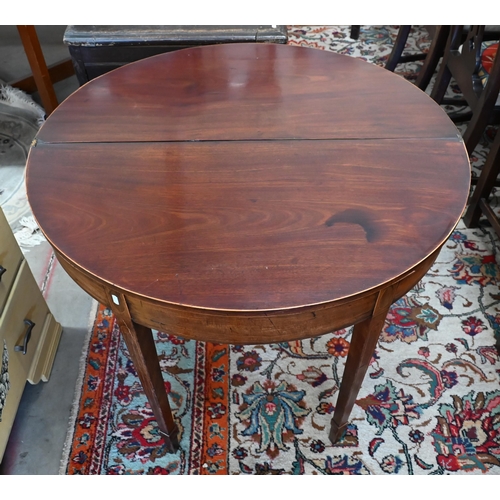 196 - A 19th century mahogany demi-lune tea table on tapering square supports with tall spade feet, 90 cm ... 