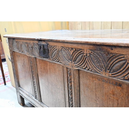 204 - An antique carved and panelled oak coffer, 132 cm wide x 58 cm deep x 72 cm high