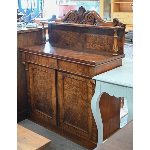 220 - A Victorian burr walnut chiffonier with two drawers over arched platform cupboard doors raised on pl... 