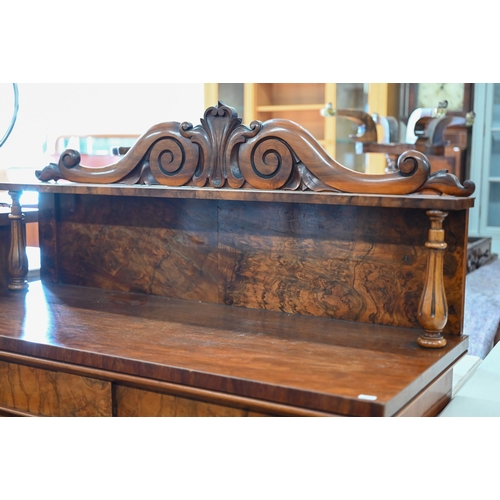 220 - A Victorian burr walnut chiffonier with two drawers over arched platform cupboard doors raised on pl... 