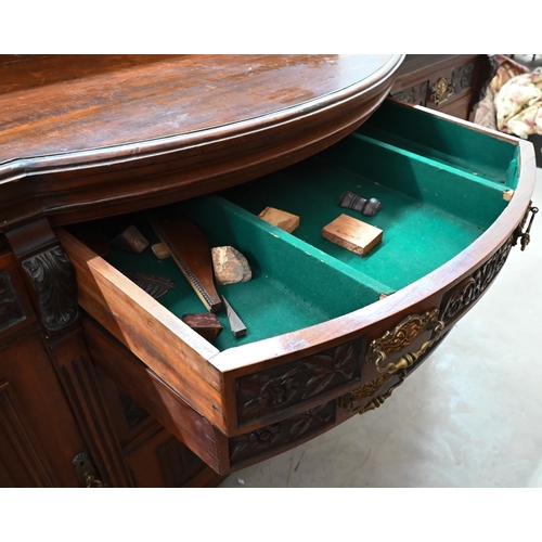 239 - A large late Victorian mahogany sideboard with floral and foliate carved door panels and drawer fron... 