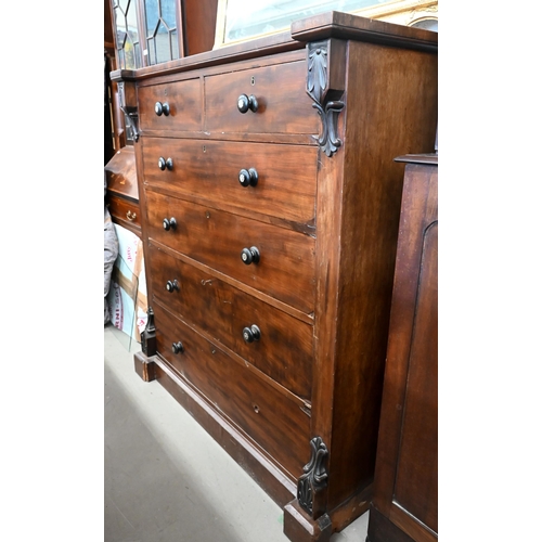 242 - A large Victorian mahogany chest of two short over four long drawers wtih mother-of-pearl ebonized h... 