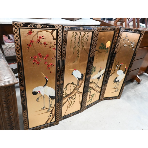 244 - A Japanese gilt and black lacquered two door cabinet decorated with red crowned cranes (Tswu), 82 cm... 