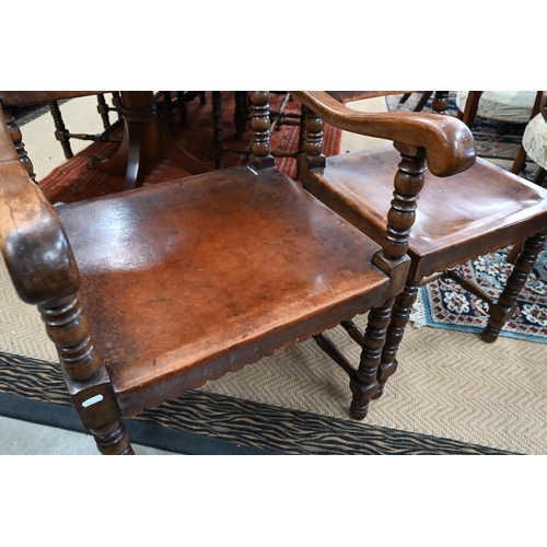 248 - A set of seven 17th century style oak framed dining chairs in the Cromwellian style, with brown leat... 