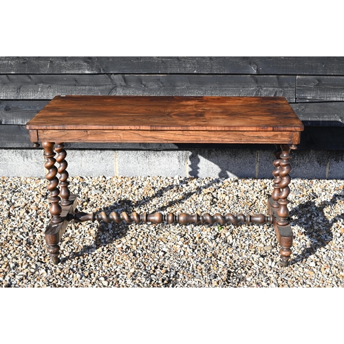 253 - A Victorian rosewood console table with barley twist supports and stretcher, turned legs on casters,... 