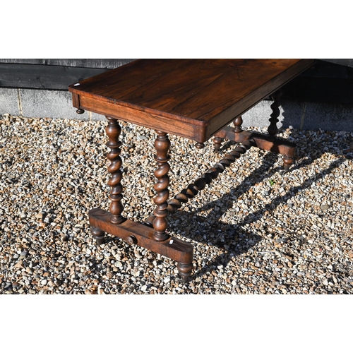 253 - A Victorian rosewood console table with barley twist supports and stretcher, turned legs on casters,... 