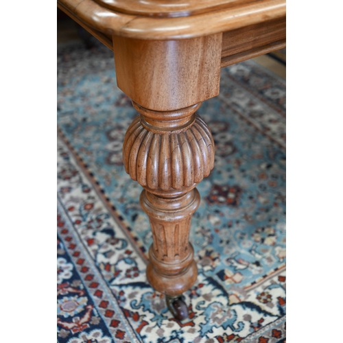 257 - A late Victorian mahogany extending dining table, the moulded rectangular top winding out to accept ... 