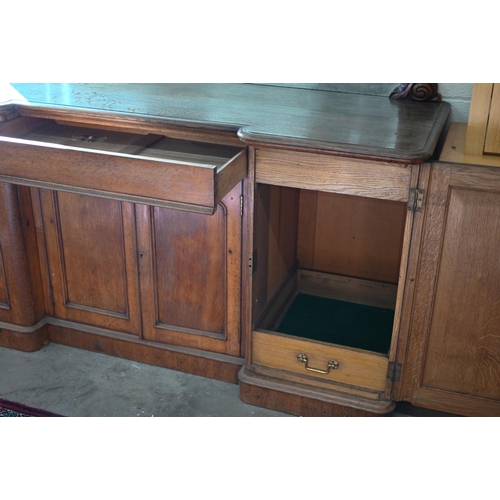 267 - A 19th century oak inverted breakfront mirror-backed sideboard with single central drawer and arch-p... 