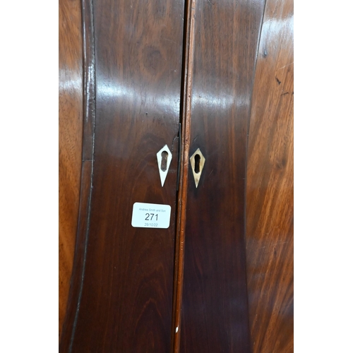 271 - A 19th century mahogany linen press, the top with oval panelled doors enclosing four slides on a che... 