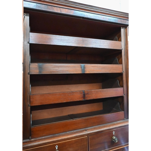 271 - A 19th century mahogany linen press, the top with oval panelled doors enclosing four slides on a che... 