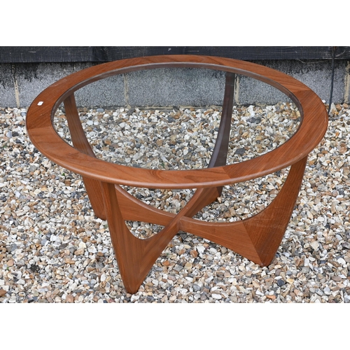 276 - A G-Plan teak 'astro' coffee table, circular inset glass top on shaped base, 84 cm diam x 46 cm high... 