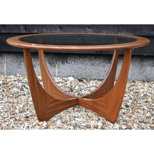 279 - A G-Plan teak 'Astro' coffee table, circular inset glass top on shaped base, 84 cm diam x 46 cm high... 