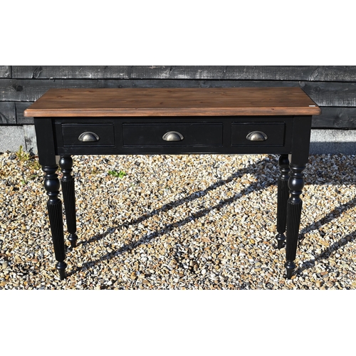 283 - A narrow hall table with stained pine top on black painted three drawer base with turned and reeded ... 