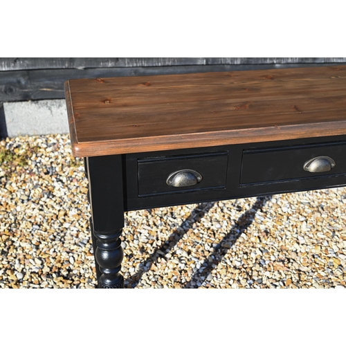 283 - A narrow hall table with stained pine top on black painted three drawer base with turned and reeded ... 