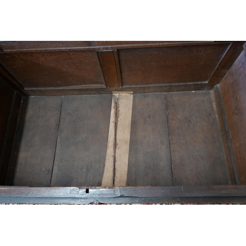 297 - An antique oak coffer with arcade carved panelled front, on bun feet, 132 cm wide x 66 cm deep x 65 ... 