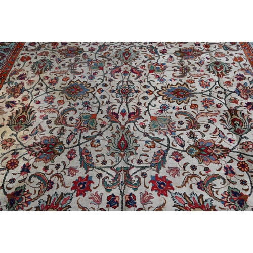 299 - Large Persian Tabriz carpet, traditional floral design on cream ground orange and turquoise palmette... 