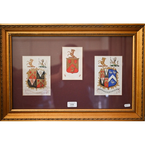 318 - A trio of heraldic crests framed as one, 29 x 48 cm overall