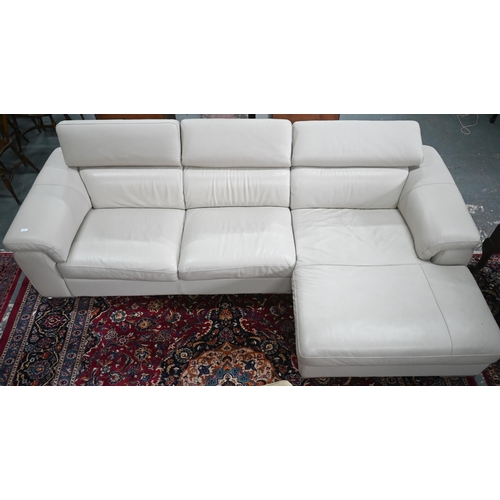 377 - An Italian off-white leather corner sofa in two sections, with adjustable head rests, on chrome feet... 