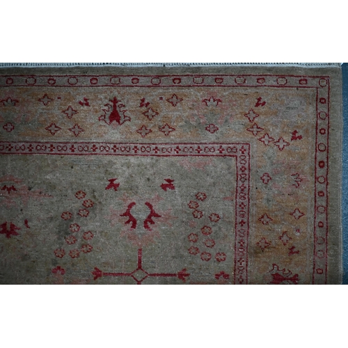 396 - An Indian Agra camel ground carpet, 238 cm x 191 cm