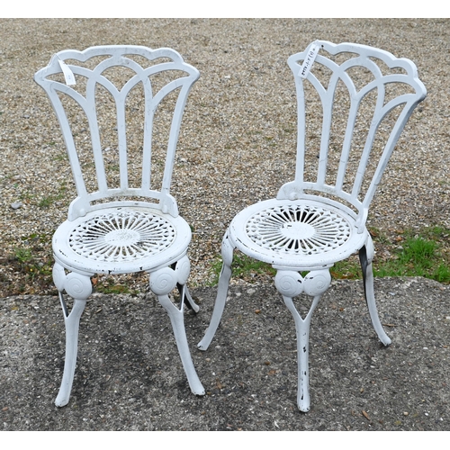 404 - A Victorian style cast metal terrace table and two chairs (3)