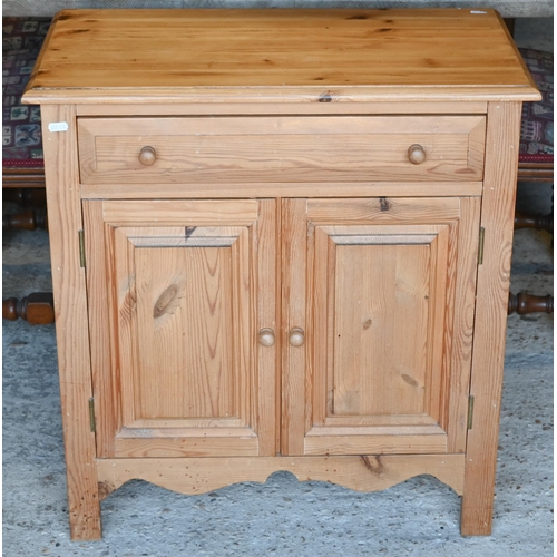 432 - A modern pine bedside cabinet with a single drawer over pair of cupboards, 65 x 35 x 69 cm h