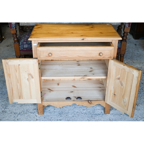 432 - A modern pine bedside cabinet with a single drawer over pair of cupboards, 65 x 35 x 69 cm h