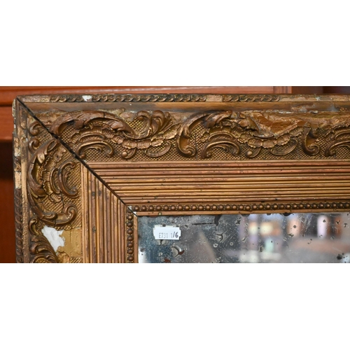 449 - An antique distressed full length mirror plate in an equally distressed giltwood and gesso frame a/f... 