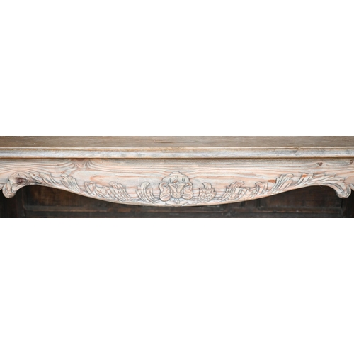 461 - An old stripped pine part carved coffee table on cabriole legs, 140 x 70 x 46 cm