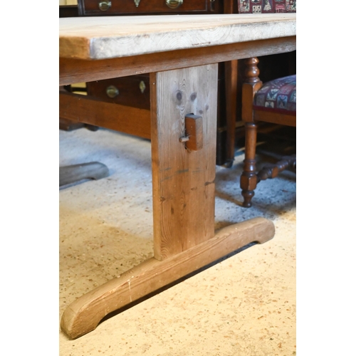 462 - An old pine trestle table, 150 x 90 x 67.5 cm h