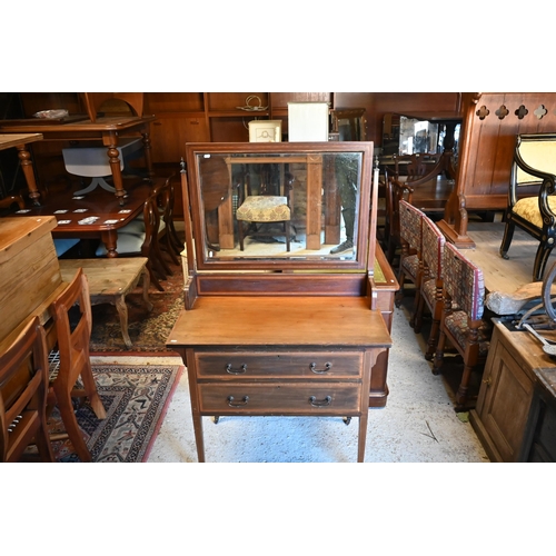 468 - An Edwardian crossbanded satinwood mirror-backed dressing chest with two long drawers on square tape... 