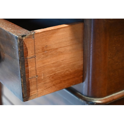 475 - A Victorian mahogany twin pedestal desk with inset tooled green leather top over an arrangement of n... 