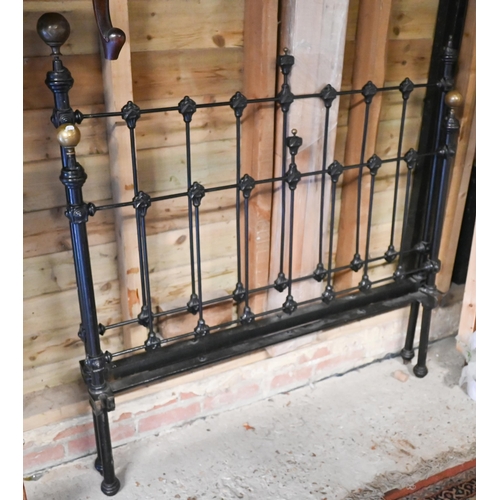 495 - An antique cast iron and brass mounted double bed, painted black with wood slat base (missing 1 bras... 