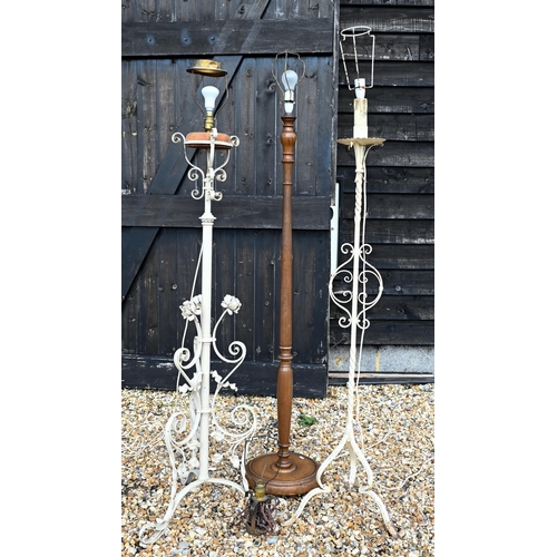 500 - Two antique wrought iron/steel standard lamps, converted from an oil lamp and later painted, to/w a ... 