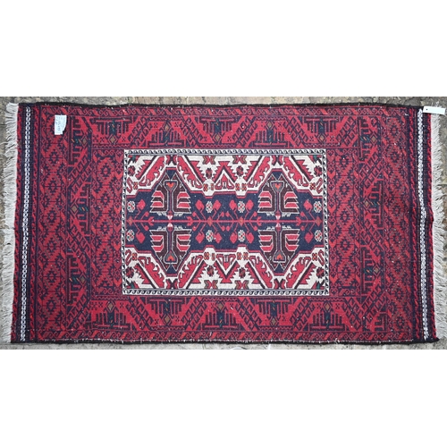 506 - An old Afghan Belouch, kelim ends, red ground, 165 x 98 cm