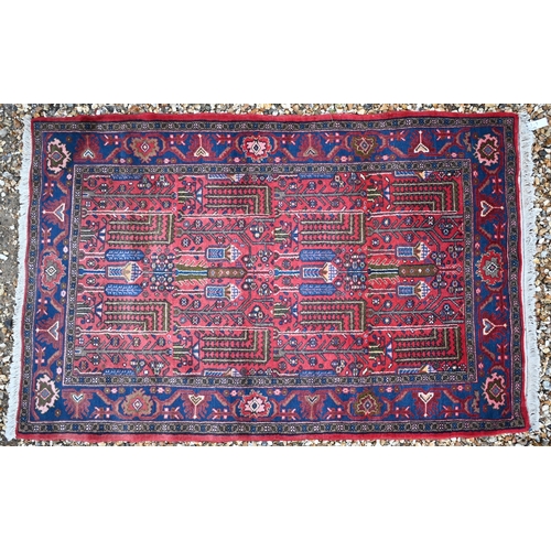 508 - A Persian Hamadan rug, the geometric design on pale red/blue ground, 155 x 100 cm