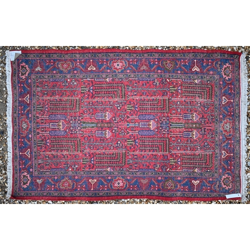 508 - A Persian Hamadan rug, the geometric design on pale red/blue ground, 155 x 100 cm