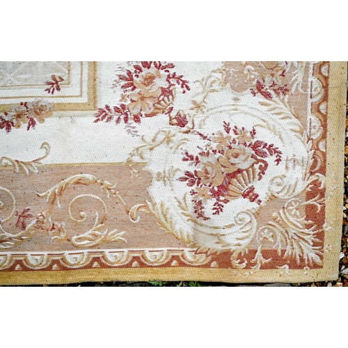 511 - A traditional Savonnerie design woven rug, ochre yellow with dusky red design, 230 x 160 cm