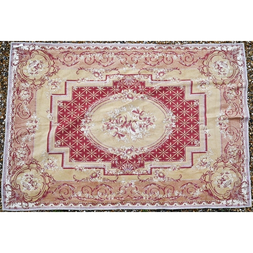 511 - A traditional Savonnerie design woven rug, ochre yellow with dusky red design, 230 x 160 cm