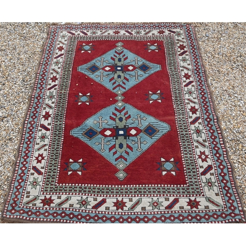 515 - Two Turkish handmade rugs, geometric design on brown-red ground, 160 x 152 and 109 x 85 cm (2)