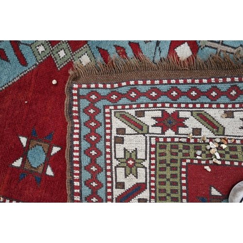 515 - Two Turkish handmade rugs, geometric design on brown-red ground, 160 x 152 and 109 x 85 cm (2)