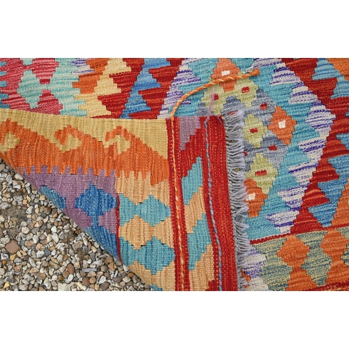 516 - A contemporary Turkish multi-coloured geometric design wool kelim, 199 x 153 cm