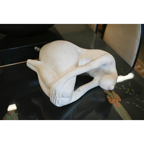 526 - A modern abstract white fibreglass sculpture of a seated female nude, without base, 33 cm high 