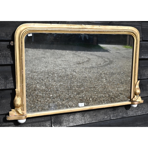 527 - An antique over mantel mirror in moulded gilt wood frame, 104 cm w x 63 cm h 