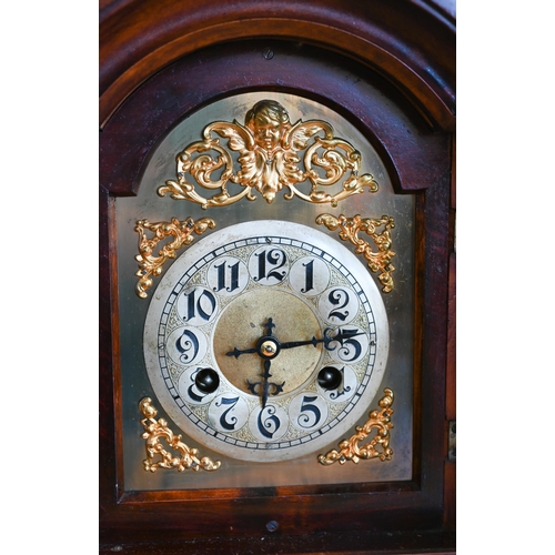 529 - An Elliott, London walnut cased brass mounted mantel clock with twin-train movement striking on a be... 