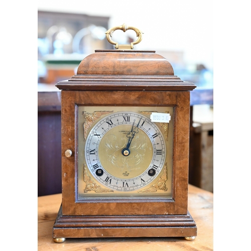 529 - An Elliott, London walnut cased brass mounted mantel clock with twin-train movement striking on a be... 